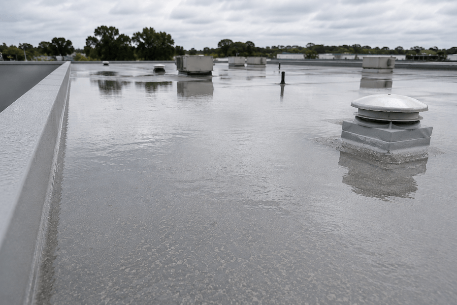 Coated commercial roof with standing water and no coating failure